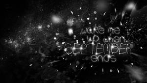 發光文字寫著 wake me up when september ends，在深色背景上閃爍