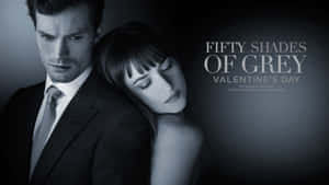 一男一女緊密擁抱，附有文字 Fifty Shades of Grey 情人節。