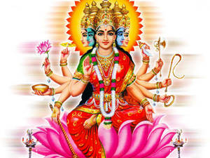 多臂印度教女神坐在粉紅蓮花上，手持神聖物品。
