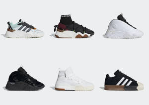 六款不同的 Adidas 運動鞋並排展示在白色表面上。