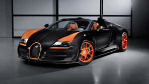 在簡約工作室環境中的黑色和橙色Bugatti Veyron跑車。