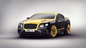 工作室環境中的黑色和黃色賓利 Continental GT 跑車。
