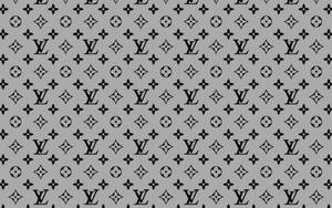 灰色背景，帶有重複的黑色 Louis Vuitton 標誌和花卉符號。