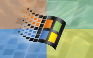 Microsoft Windows 標誌由漸變背景上落下的彩色方塊形成