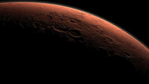 火星行星表面在太空夕陽餘暉下呈現隕石坑 — 火星 GIF 壁紙