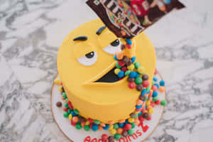 Pac-Man 蛋糕，M&M's 從袋子倒進嘴裡。