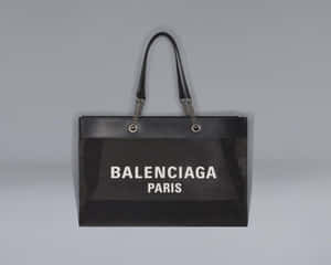 黑色Balenciaga Paris手提袋，正面網眼設計，鏈條手柄。