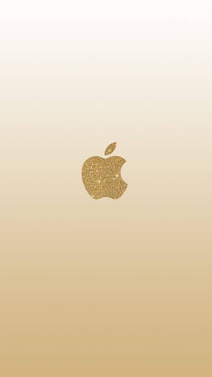 金色閃粉Apple標誌在米色漸變背景上。
