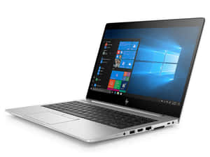 銀色HP手提電腦在白色背景上打開，帶有Windows 10介面。