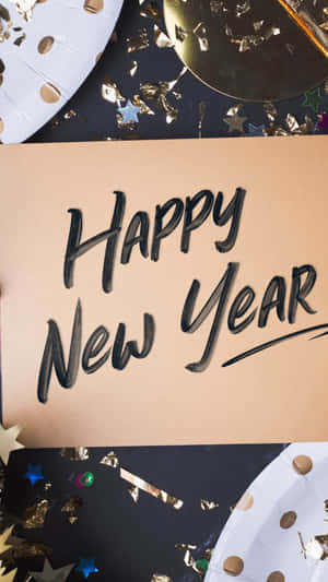 新年快樂賀卡，帶有金色紙屑和星星裝飾。 — 9:16 壁紙