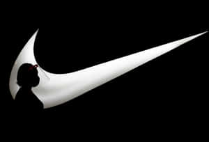 一個人在發光的Nike標誌前的剪影。