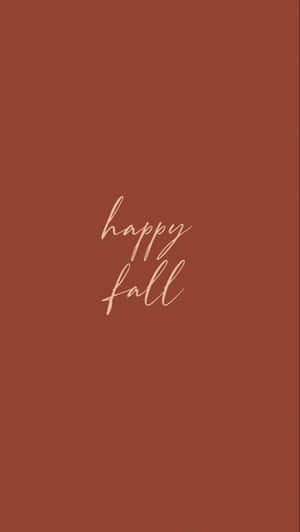 在溫暖的陶土色背景上以手寫體呈現的 happy fall 文字。