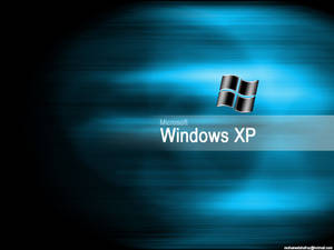 藍色漸變桌面背景上的 Windows XP 標誌