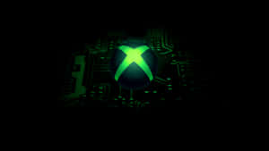 深色電路板背景上的發光綠色Xbox標誌。