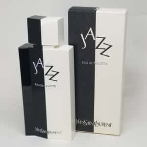 黑白 Yves Saint Laurent Jazz 香水瓶和盒子。 — Y2k 美學 壁紙