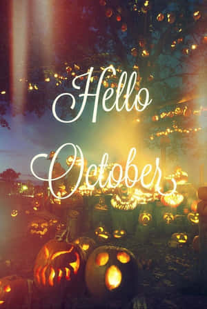 發光的南瓜和燈串，樹下有「Hello October」文字。