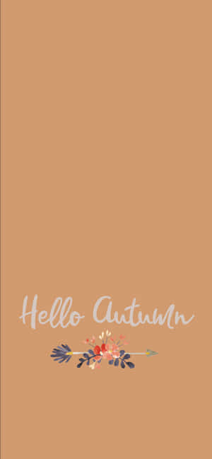 陶土背景上帶有花卉箭頭設計的「Hello Autumn」文字