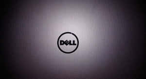 Dell 標誌在帶有紋理的灰色背景上，帶有漸變照明。