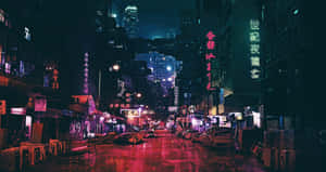 雨夜中閃爍著霓虹招牌和高樓大廈的濕滑城市街道。 — 唐人街 GIF 壁紙