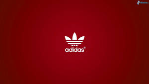 白色adidas標誌在紅色漸變背景上