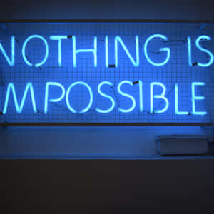 藍色霓虹燈牌在網格牆上寫著 nothing is impossible。