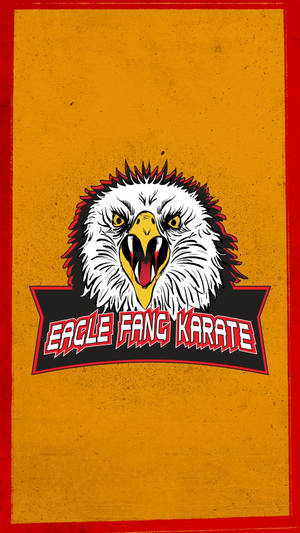 Eagle Fang Karate 標誌，特色是帶有鋒利牙齒的兇猛鷹頭和粗體紅色文字。