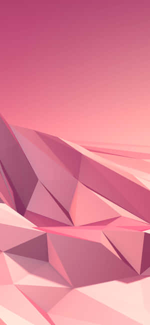 柔和漸變天空下的粉紅色幾何山脈。 — Pixel 8 Pro 壁紙