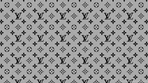 灰色背景上重複的黑色 Louis Vuitton 標誌和花卉符號。