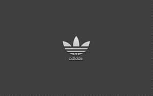 Adidas標誌在斜紋灰色背景上