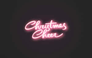 粉紅色霓虹燈牌在深色背景上顯示Christmas Cheer。