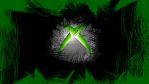 發光的綠色Xbox標誌，帶有深色筆觸背景 — Xbox GIF 壁紙
