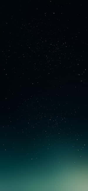 一個有漸變青綠色地平線的星空夜空。