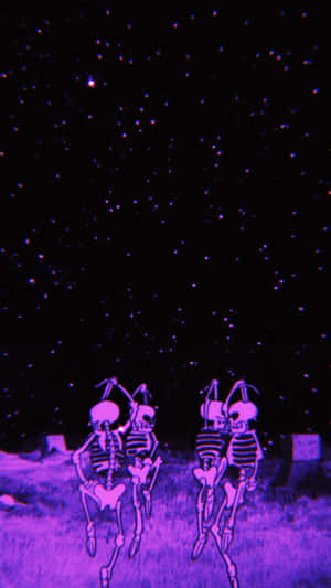兩個發光的骷髏在紫色星空下跳舞。