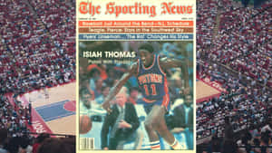 Isiah Thomas身穿活塞隊球衣在雜誌封面上運球，背景是球場觀眾。 — 波士頓塞爾特人 GIF 壁紙