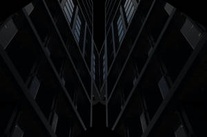 黑色摩天大樓在黑色夜空中聳立，窗戶亮著燈光。 — 黑色動態圖 壁紙