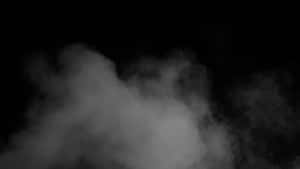 黑色背景上的旋轉煙霧營造出神秘且富有氣氛的效果。 — 煙霧動畫 壁紙