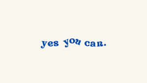 奶油色背景上藍色草書文字寫著 yes you can。