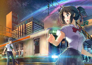 穿著校服的女孩在星空夜空下的火車站揮手。