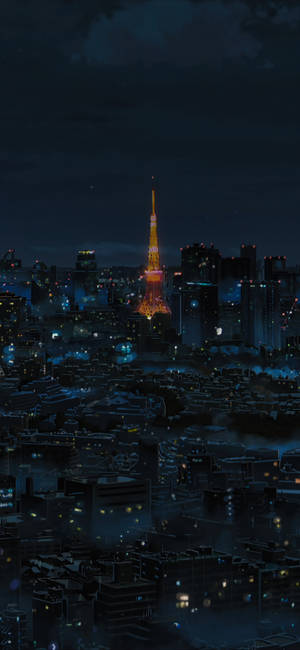 夜晚的東京塔，閃爍的城市燈光和迷濛的氛圍。 — iPhone 17 壁紙