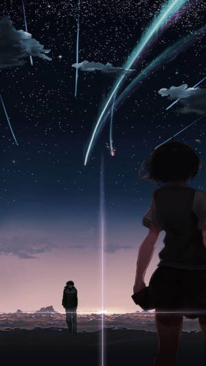 兩個剪影人物觀看閃爍流星劃過星空夜空。