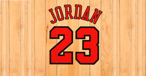 紅色 Jordan 23 球衣標誌，木質背景。