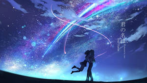 一對剪影情侶在星空下接吻，伴有發光的痕跡。