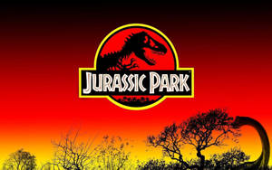Jurassic Park 標誌與恐龍剪影，背景為日落天空。