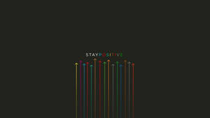 多彩向上的箭頭，帶有「STAY POSITIVE」文字，背景為深色。 — 激勵 壁紙