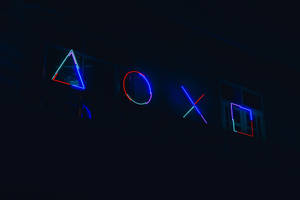 建築物外牆上夜間發光的霓虹燈PlayStation控制器符號。