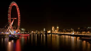 倫敦天際線夜景，倫敦眼和大笨鐘在泰晤士河上亮起。 — 天際線 壁紙