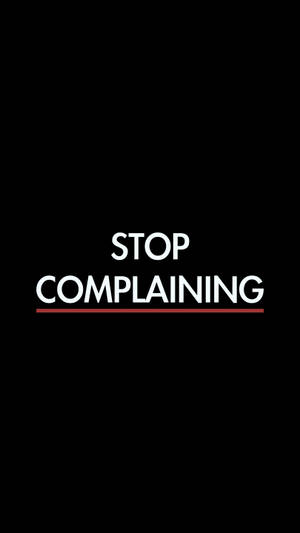 粗體白色文字寫著 stop complaining，在黑色背景上以紅色底線標示。