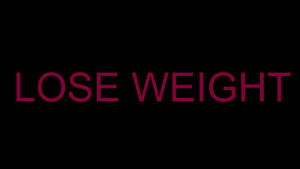 黑色背景上寫有「lose weight」的粗體洋紅色文字