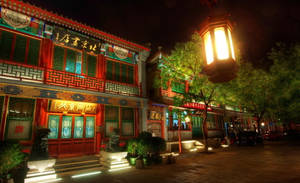 夜晚被溫暖嘅燈籠照亮嘅傳統中國建築。