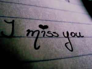 橫線紙上手寫訊息，寫著 I miss you，並有一顆心。